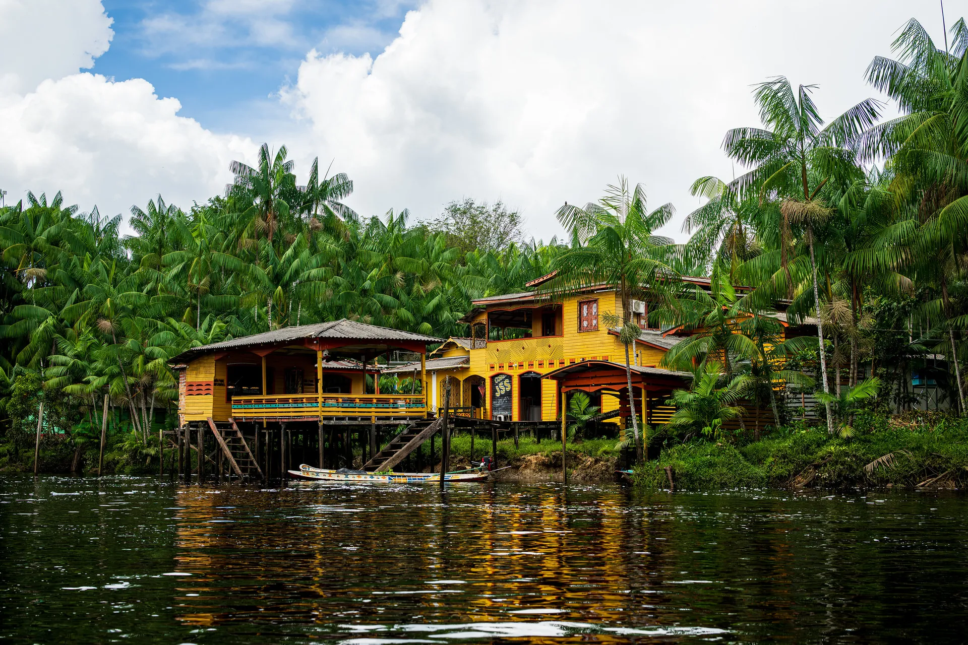 Yellow house on a river