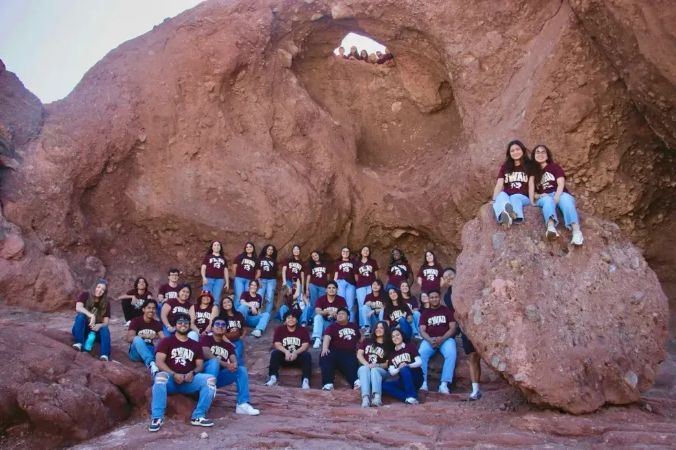 University singers on rocks