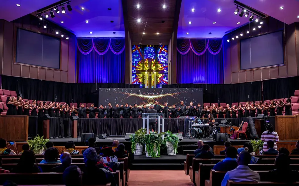 University Singers in a church