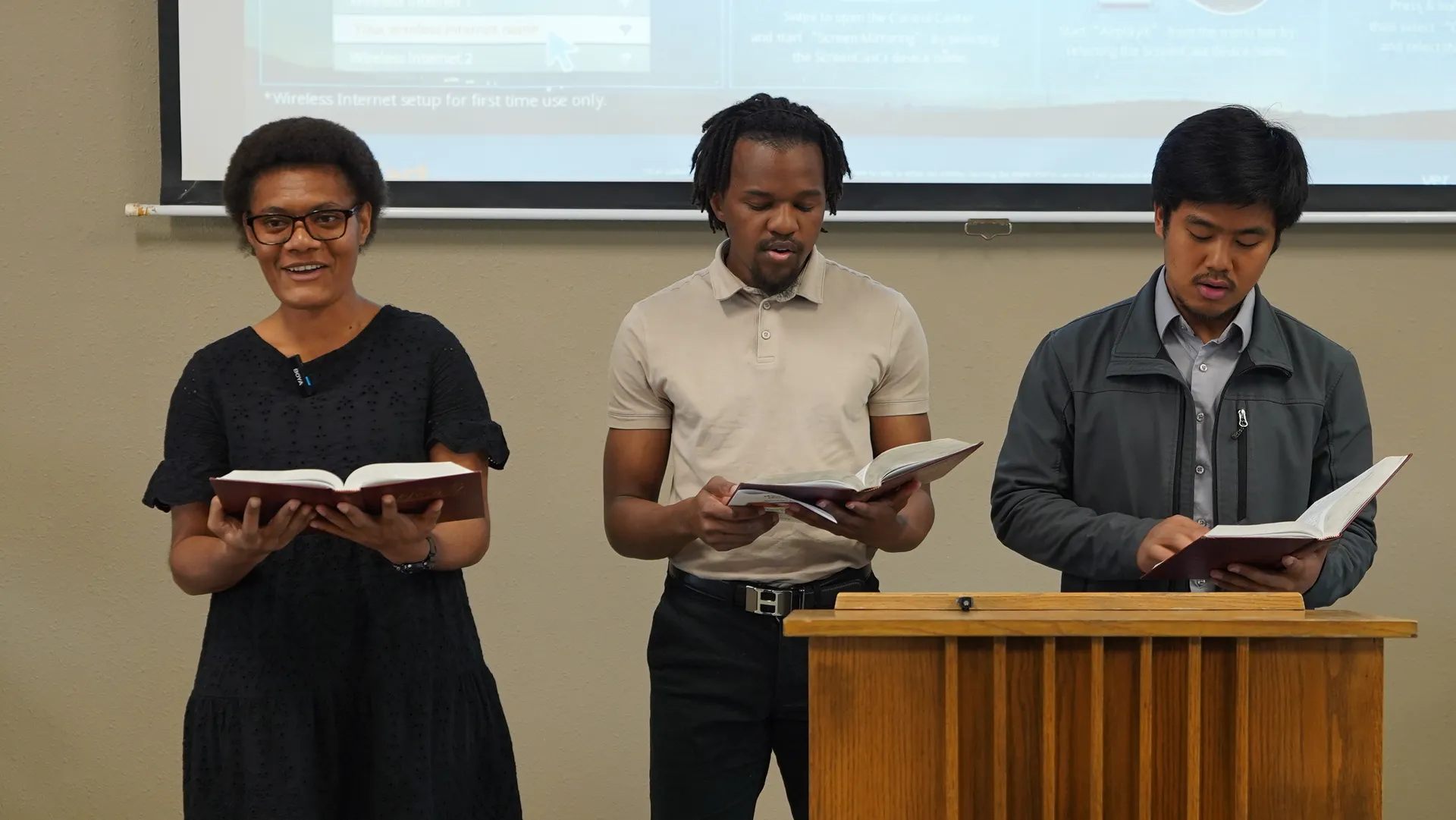 Students with hymnals at church service