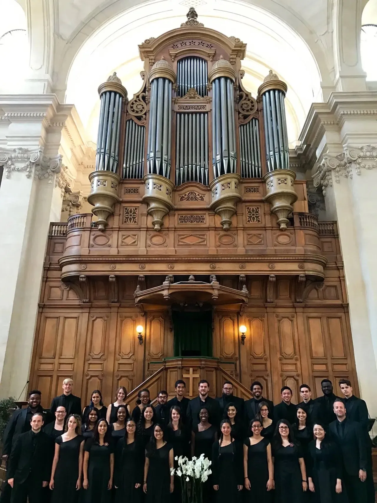 University Singers Group Photo in front of large organ