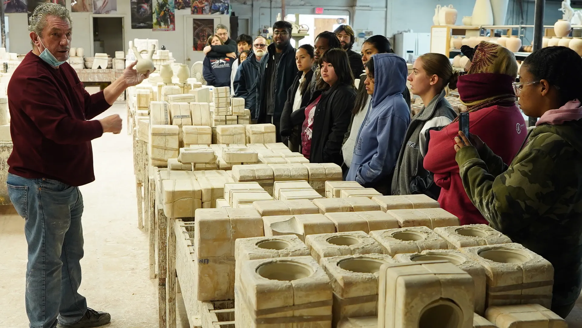 Students learning about pottery