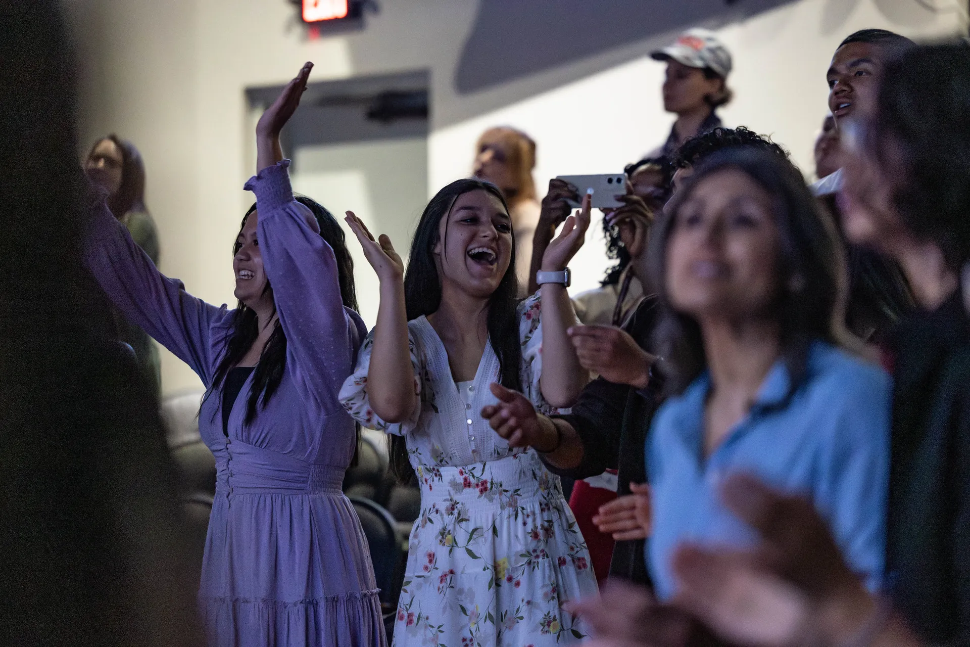 girls praising and clapping