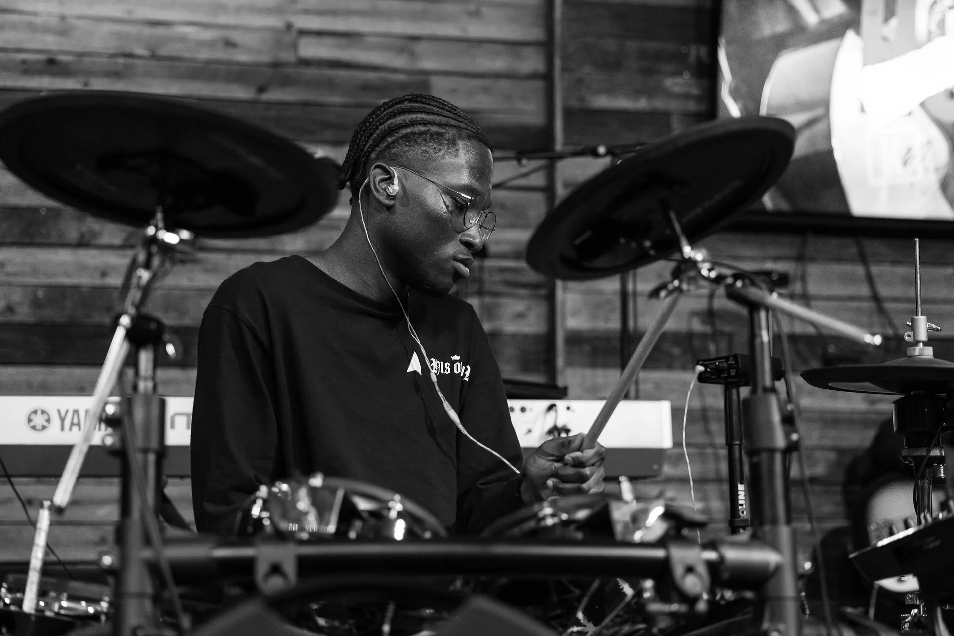 guy on drums in grayscale