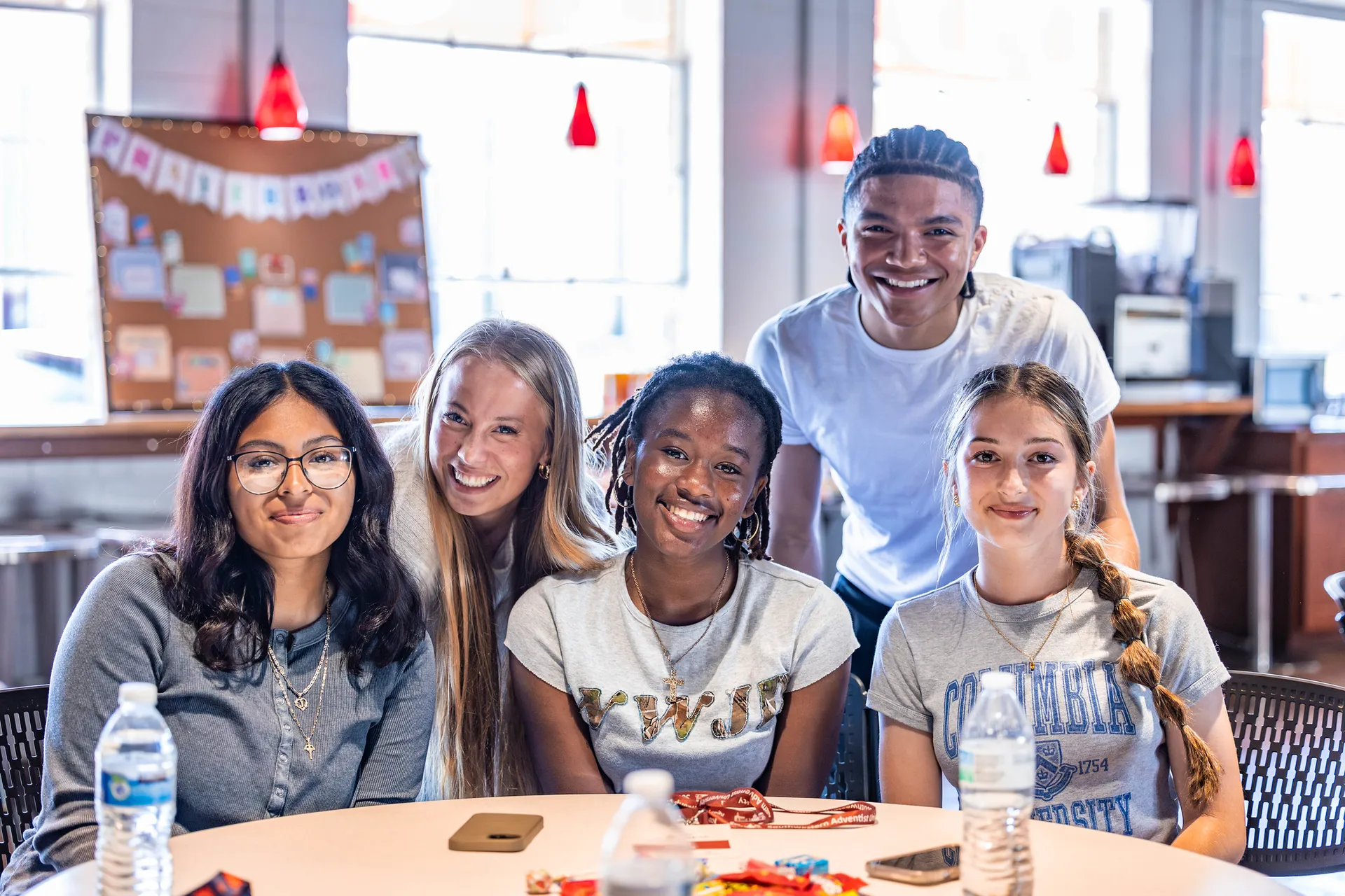 girls at table smiling