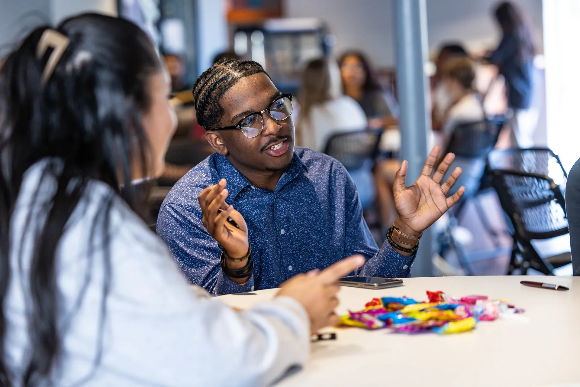 guy having discussion at table