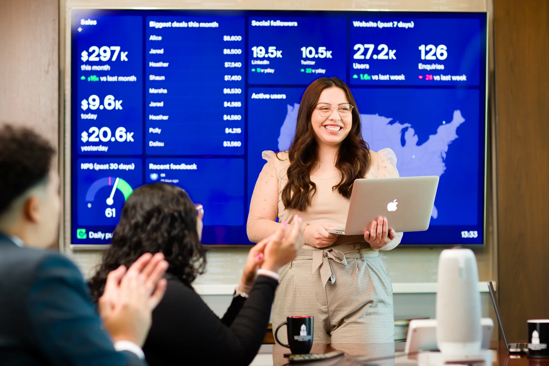Student presenting with laptop in front of TV