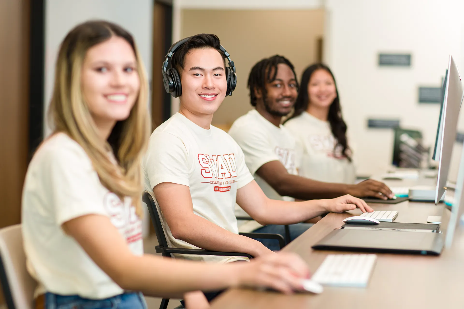 Students sitting in front of computers