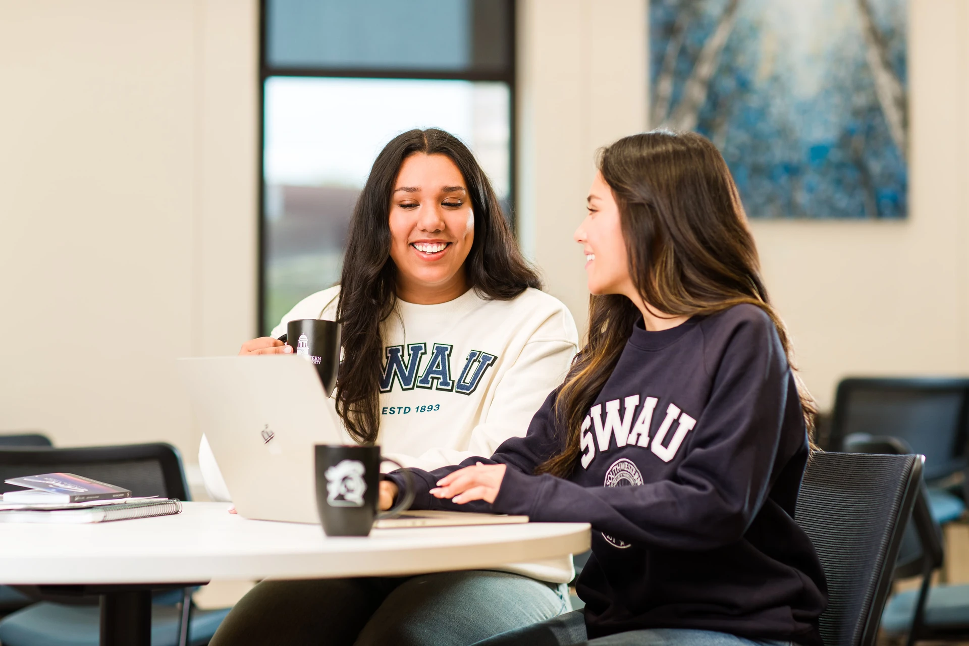 Student helping another student study